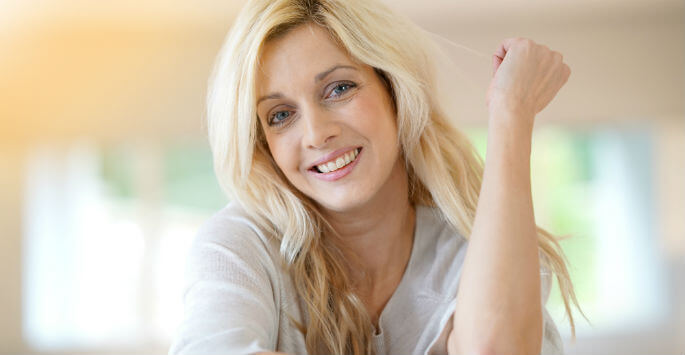 Woman with long blonde hair smiling