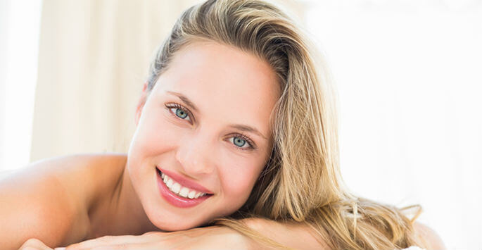 Relaxed blonde-haired woman smiling