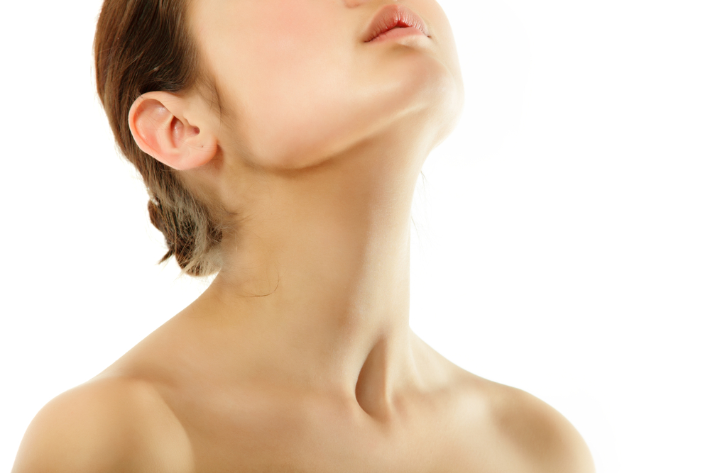 Close-up of a woman's chin and neck area