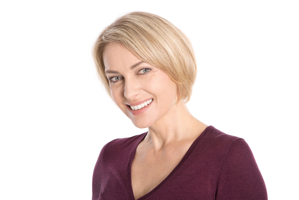 Mature woman with a blonde bob smiling